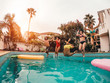 © Alessandro Biascioli - Group of happy friends jumping in pool at sunset time - Crazy young people having fun making party in exclusive tropical house - Holidays, summer, vacation and youth lifestyle concept