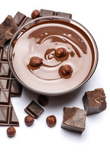 Wall Mural - glass bowl of chocolate cream or melted chocolate isolated on white