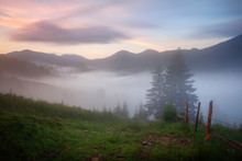 Foggy Colorful Sunrise In Mountain Valley