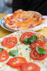 authentic Italian pizza with tomatoes, spinach and cheese. Florence, Italy. 