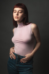 Attractive young woman in shirt. Studio portrait