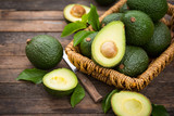 Fototapeta  - Fresh organic avocado on the wooden table