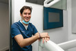 © MyMicrostock/Stocksy - Young smiling doctor looking at camera