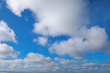 blue sky with white clouds to horizon