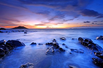 Beautiful sunset on the sea with rocks in foreground, In the eastern part of Thailand