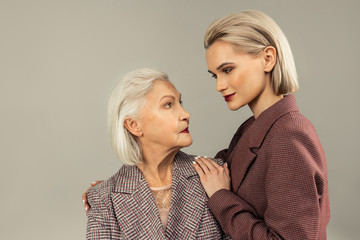 delighted attractive woman smiling to her mother