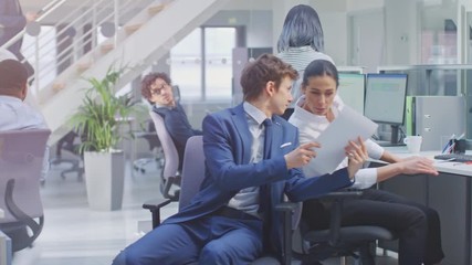 Wall Mural - Diverse Team of Business Managers and Specialists Work on Desktop Computers with Two Rows of Tables Side by Side. Young and Motivated Business people in Modern Open Office.