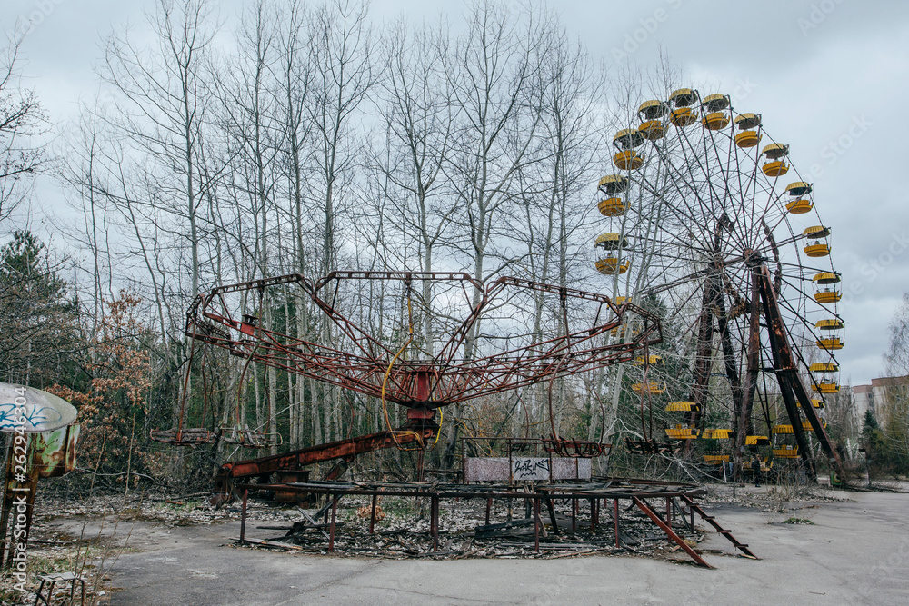Abandoned carousel and abandoned ferris at an amusement park in the ...