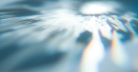 Wall Mural - Overflows of Diamond Edges. Loop. The light passes through the facets of a slowly rotating diamond and creates repetitive sparkling highlights and rainbow colors