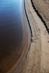 Canvas Print - Sand beach. curved coastline