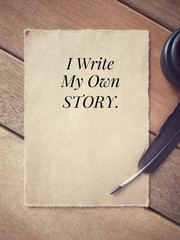 Wall Mural - Motivational and inspirational wording - I Write My Own Story written on a paper.