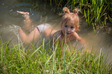 concept of children life. little child having fun in a beach. happy child playing in the nature . ki