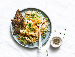 Cabbage chicken fillet stewed on a light background, top view. Healthy diet food concept