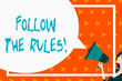 © Zofia - Writing note showing Follow The Rules. Business concept for go with regulations governing conduct or procedure Speech Bubble Round Shape. Woman Holding Colorful Megaphone