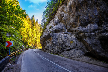 Fototapete - road in mountains. Bicaz Canyon in fall season. Potentially dangerous hairpin curve on a mountain road. Canyon is one of the most spectacular roads in Romania- Carpathian Mountains. Bicaz Canyon.