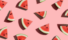 Sliced Watermelons Arranged On A Pink Background