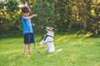© alexei_tm - Preschooler kid boy doing dog obedience training classes with his pet