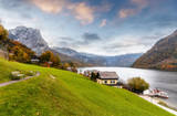 Fototapeta Góry - Scenic image of fairy-tale Alpine valley with lake Grundlsee and Mountain Backenstein on background. awesome Austrian alps. villas and hotels On  lakeside. Grundlsee, Salzkammergut, Styria, Austria