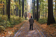 © YuSafa - elderly man in a city park, stands back, season is autumn