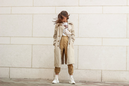 portrait shooting of a stylish girl. beige shades. trends of spring and summer 2019. pants of cork.t
