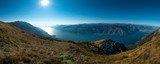 Fototapeta Na ścianę - View of the Lake Garda from Monte Baldo, Italy.Panorama of the gorgeous Garda lake surrounded by mountains in the autumn