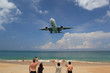 © sittinan - Phuket Thailand ‎Aprilr ‎15, ‎2019 Airplane Landing over sea at Phuket Airport, Mai Khao beach phuket thailand, popular landmark tourists people come to take photo of the plane landing over tropical