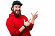 © Vulp - Happy smiling bearded guy  in red hoody, pointing with fingeres away over white background