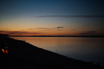 Wall Mural - sunset on the river. summer landscape. picnic