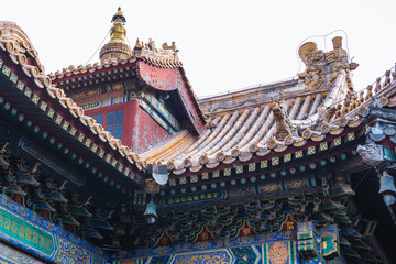 Canvas Print - Close up on a roof elements in Yonghe Temple, commonly called Lama Temple in Beijing, capital city of China