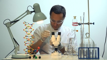 Man making a test in chemistry laboratory, science development