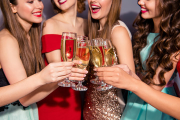  Cropped close up photo beautiful she her ladies bonding golden sparkling wine night clubbing festive social school graduation wear fashion colorful formalwear dress isolated grey background