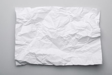 Sheet Of Crumpled Paper On Grey Background, Top View