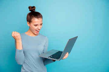 Sticker - Portrait of positive excited lady raise fists hands scream get aim lottery shout yeah stylish successful modern technology use user dressed fashionable sweater smm isolated on blue background