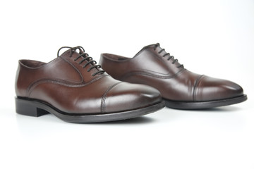 Classic men's brown shoes on white background. Leather shoes