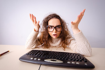 funny nerd girl working on computer