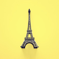 Paris symbol Eiffel Tower over yellow background