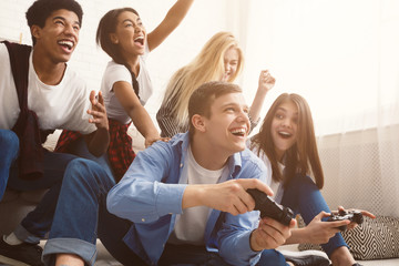 teenagers having fun, playing video games online