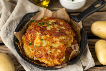 Fried homemade potato pancakes draniki with sour cream sauce