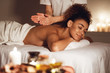 Body care. Woman enjoying relaxing back massage