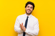© luismolinero - Businessman on isolated yellow background applauding