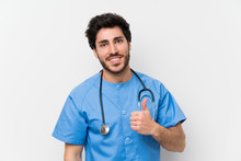 Surgeon Doctor Man Over Isolated White Wall Giving A Thumbs Up Gesture