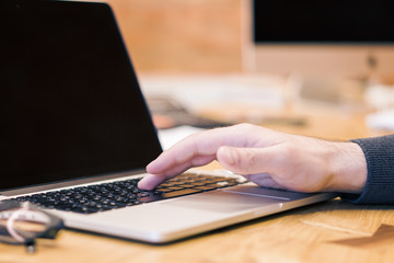 Poster - man using blank laptop screen on desktop