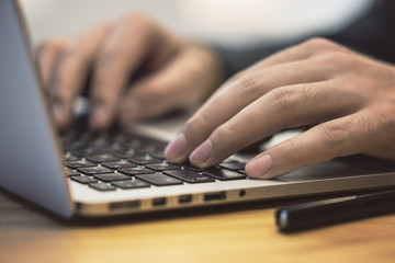 Poster - sideview of man using notebook on table