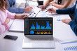 © Andrey Popov - Businesspeople Discussing Graphs