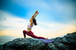 © I'm Thongchai - Young woman doing yoga exercise yoga master pose on the rock. Amazing yoga landscape in beautiful sky and enjoying sea view on wooden floor, concept for exercising, health care