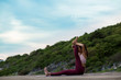 © I'm Thongchai - Rearview of Healthy women wearing exercise clothes yoga.  sitting in heron pose.Intense hamstring stretch with leg up and hands holding foot.   .beautiful mountain landscape view sky evening sunlight