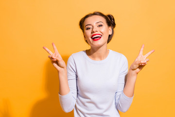 Wall Mural - Portrait of her she nice-looking attractive stunning winsome sweet lovely cheerful cheery optimistic girl showing double v-sign isolated over bright vivid shine yellow background