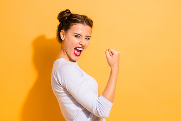 Wall Mural - Profile side view portrait of her she nice cool attractive lovely winsome sweet cheerful cheery crazy girl breakthrough lucky isolated on bright vivid shine yellow background