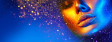 Fototapeta  - Fashion model woman face in bright sparkles, colorful neon lights, beautiful sexy girl lips. Trendy glowing gold skin make-up