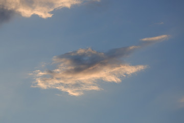 beautiful clear blue sky with golden sunshine on fluffy cloud